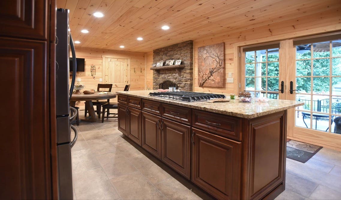  bold artwork and decor pieces paired with brown kitchen cabinets and quartz countertop