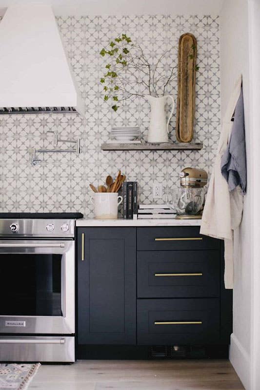 Modern kitchen with Decorative Tile backsplash and dark cabinets