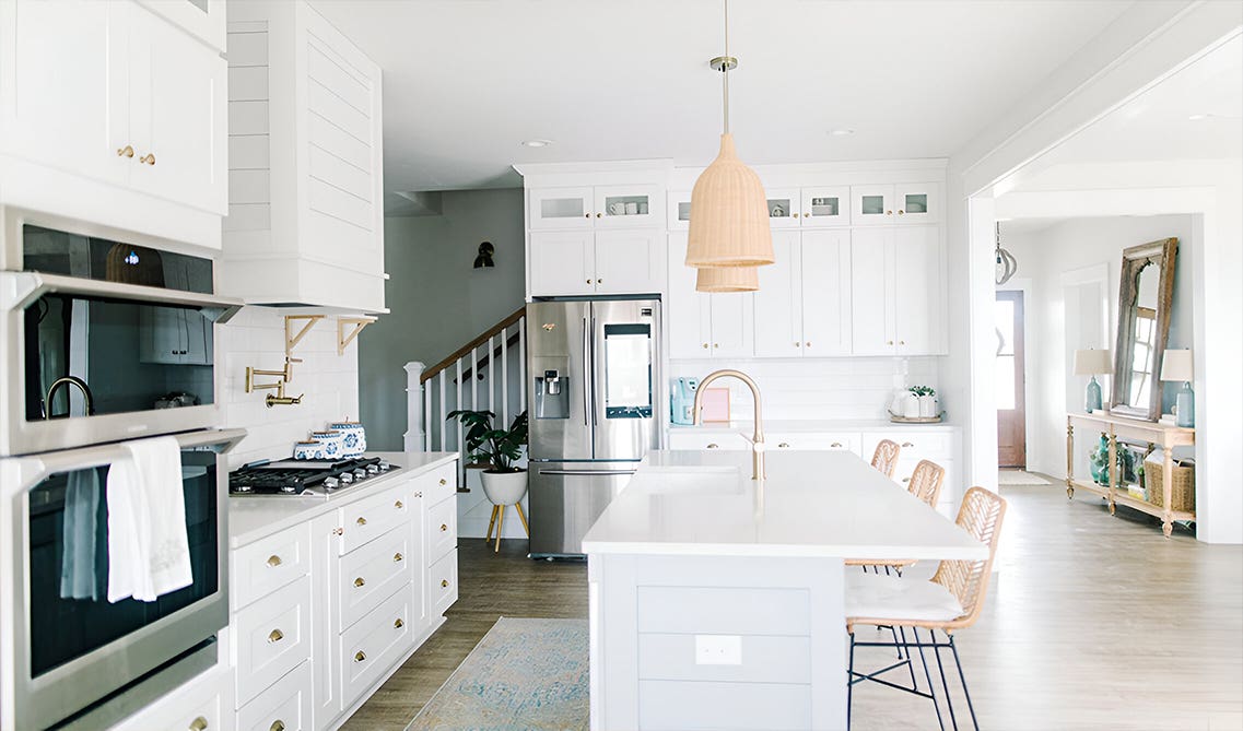 Disguised rangehood paired with white cabinets
