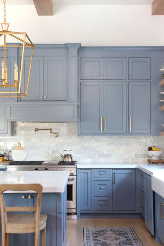 Dusty Blue kitchen cabinets with white quartz countertop