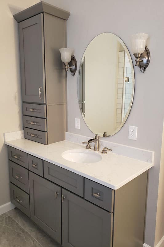 Gray shaker Vanity with modern silver faucet and white countertop