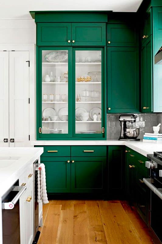 Emerald Green Cabinets with gold hardware, white countertop and SPC flooring 