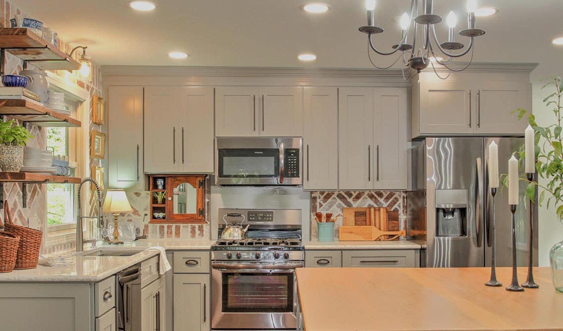 Kitchen design- gray cabinets with marble countertop, open shelvings and stainless steel appliances