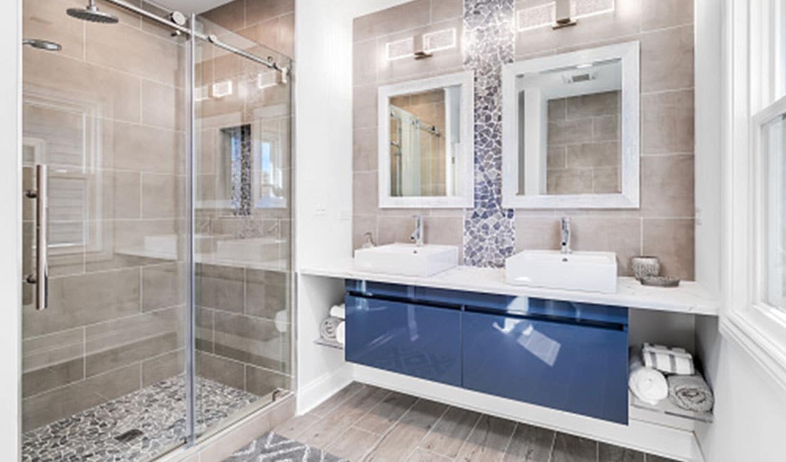 Floating Blue Vanity With Integrated Sink, glass open shelves and separate shower area