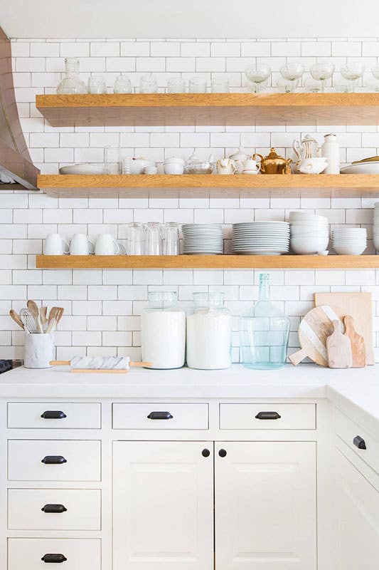 Wall mounted Floating shelves floating Dishware over white cabinets