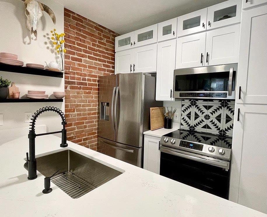 Galley 10x10 Kitchen layout with island and stainless steel appliances 