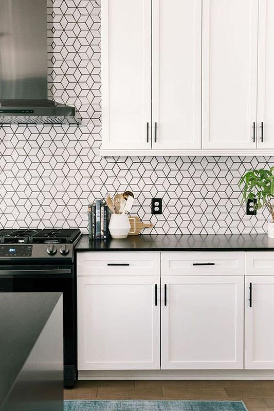 Modern kitchen with Geometric Patterns backsplash and white cabinets