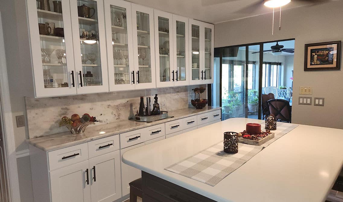 glass cabinetry kitchen with large island 