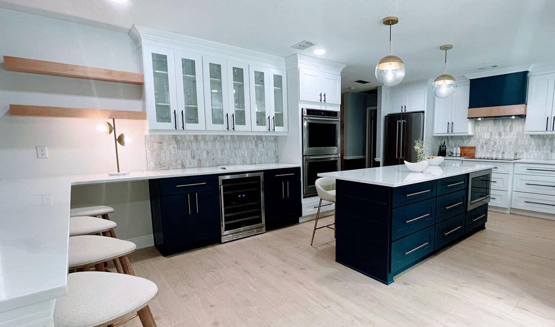 Glass front white and navy blue cabinets 