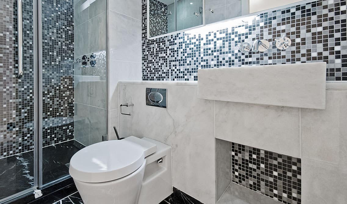 bathroom design with Glass Mosaic Feature Wall and marble sink