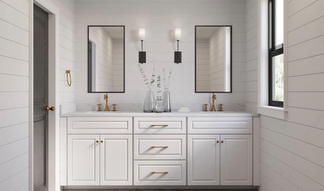 White bathroom with shaker vanity and gold fixture, faucet and hardware