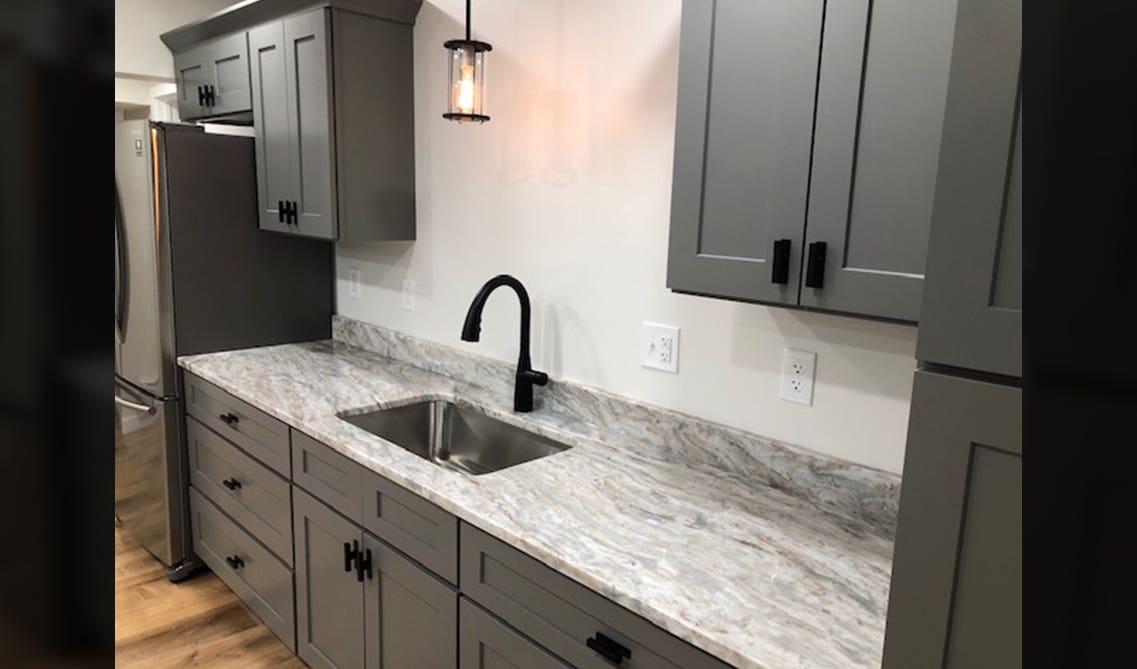 Gray Shaker Cabinet with Sea Pearl granite countertops