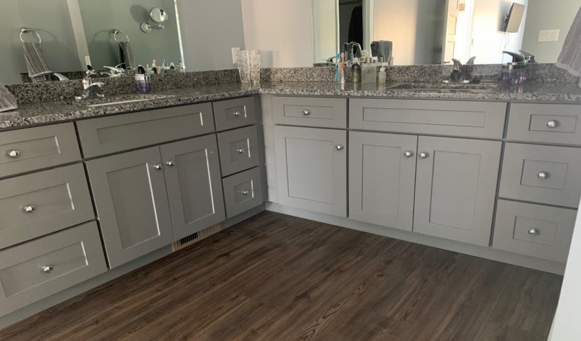 Gray shaker elite bathroom vanity with silver knobs