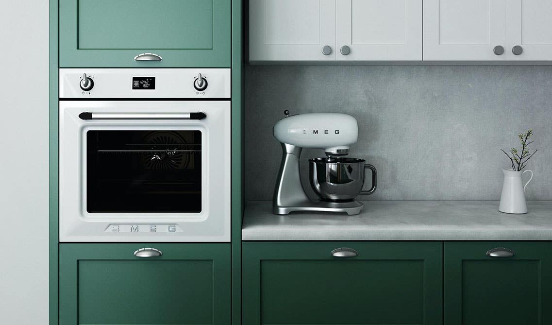 green and white cabinets with marble countertop