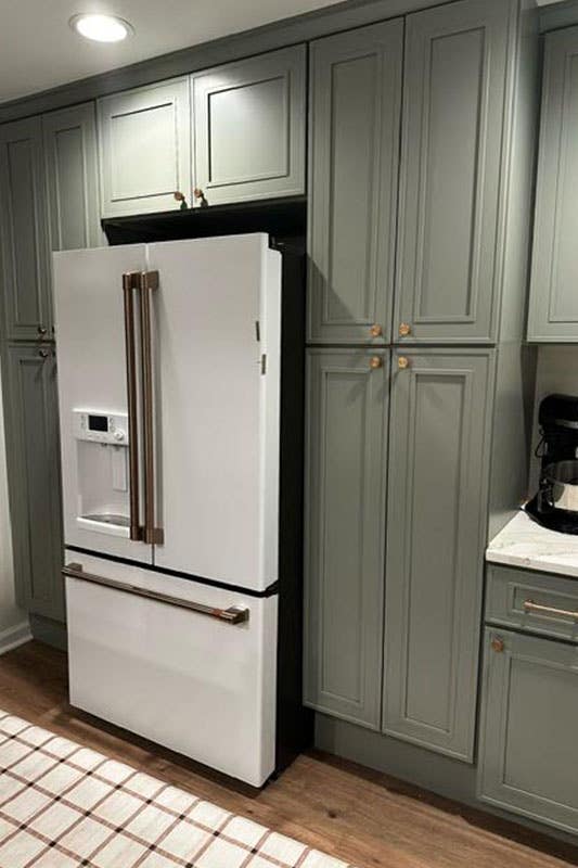 Green Cabinets with white fridge 