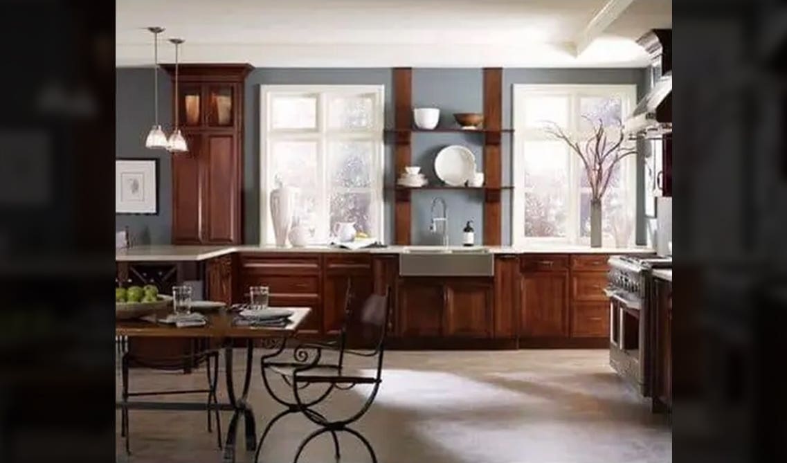 cherry cabinets with blue-grey color and floating shelves 