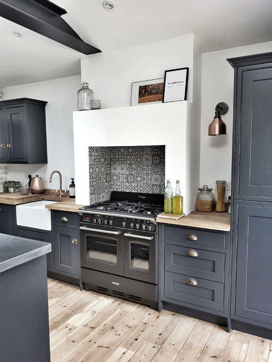 grey blue shaker cabinets with silver cup pulls and Scandinavian design wood butcher block countertops