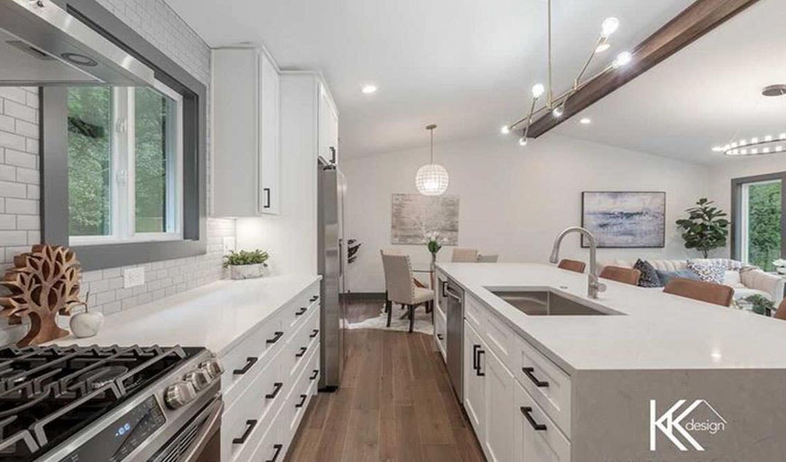 White shaker cabinets paired with hardwood flooring