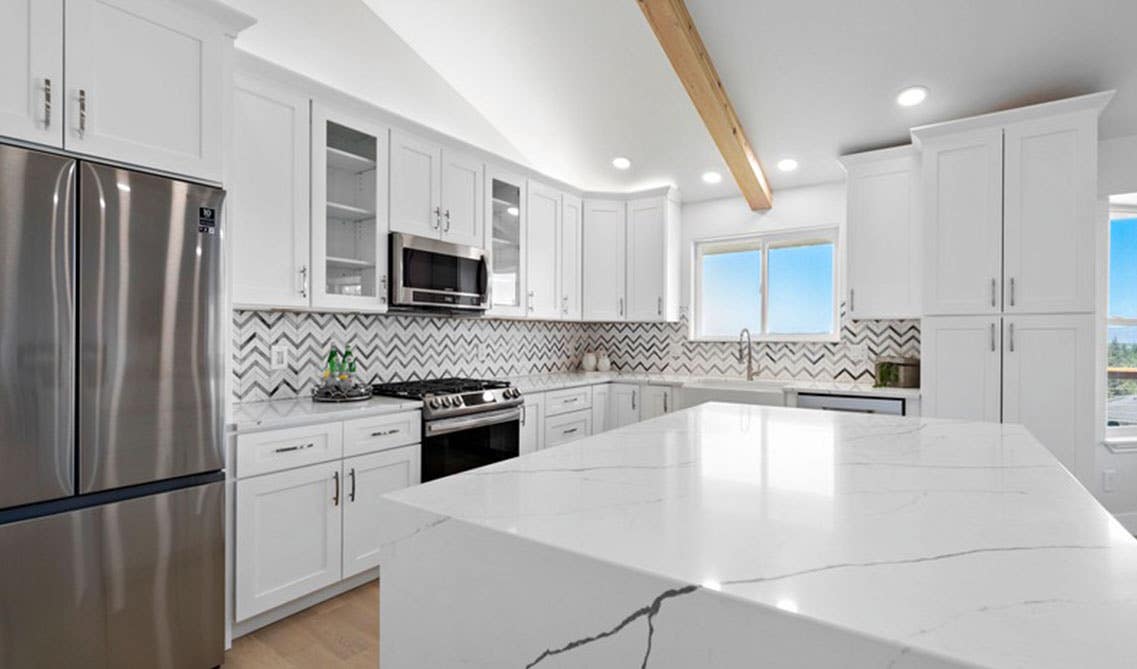 Herringbone Pattern tile paired with white kitchen