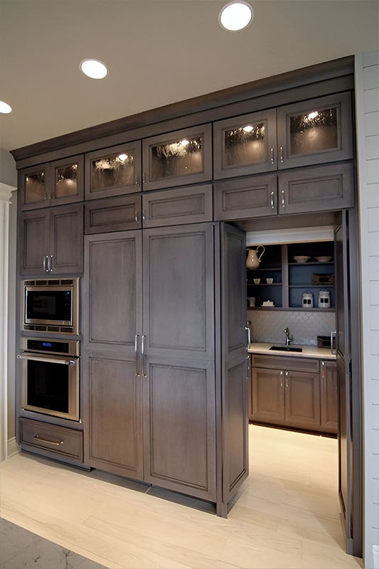 Dark concealed pantry storage cabinets