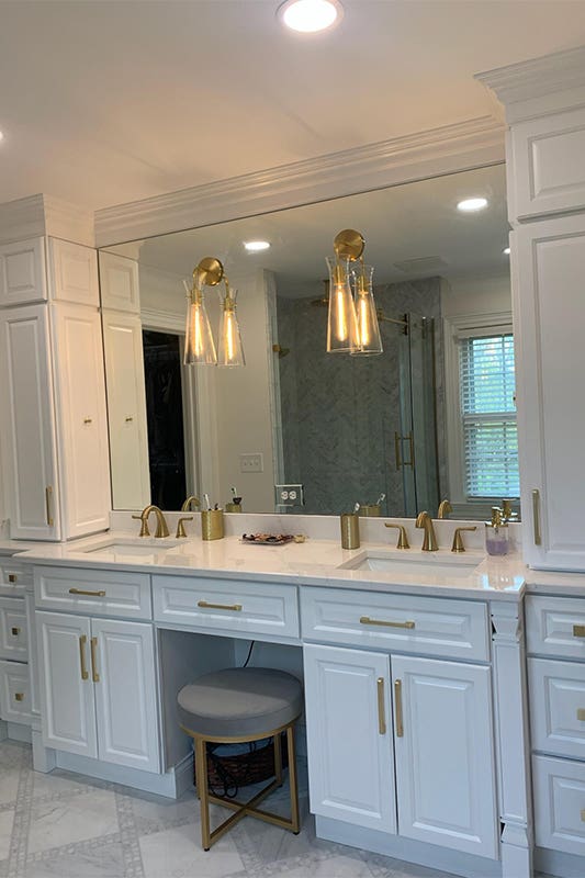 Key Largo White Vanities paired with gold accent 