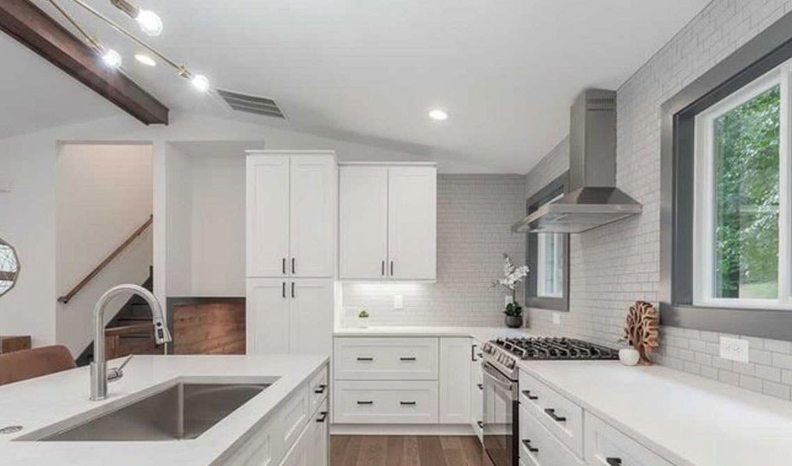 White kitchen with stainless steel appliances 