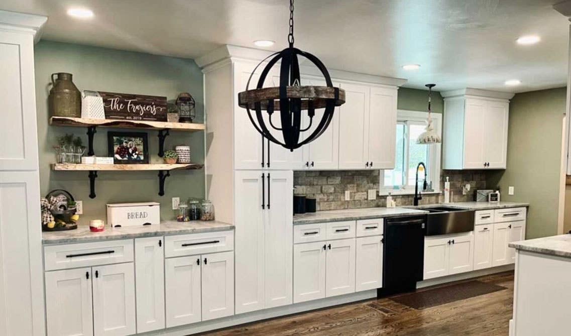 Kitchen with white cabinets and green wall color 