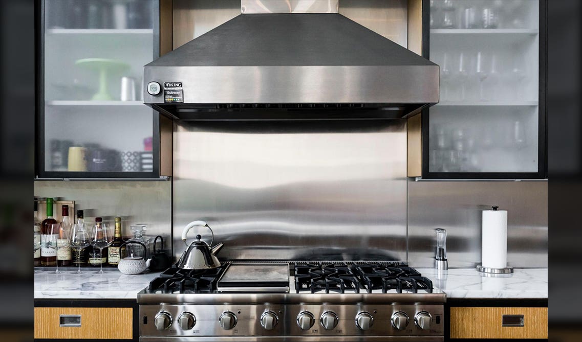 Stainless Steel stove with chimney and wall glass door cabinets