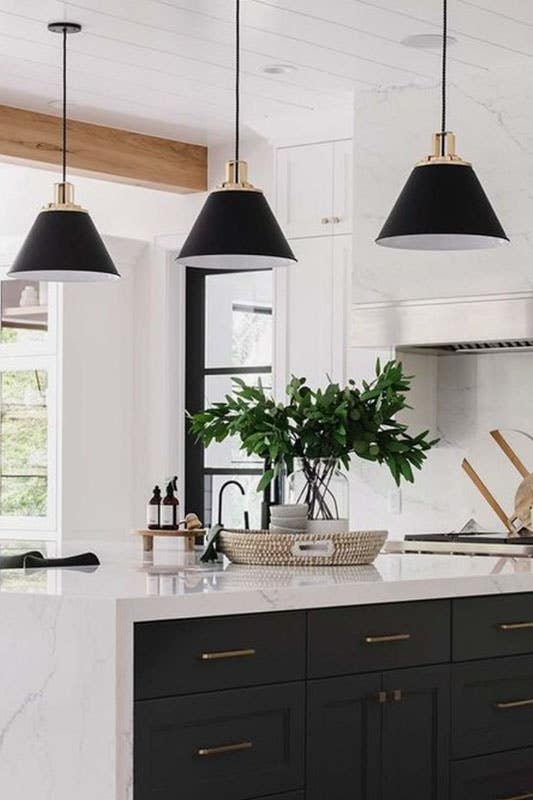 Kitchen with Personalized with gold Accent and waterfall countertop 