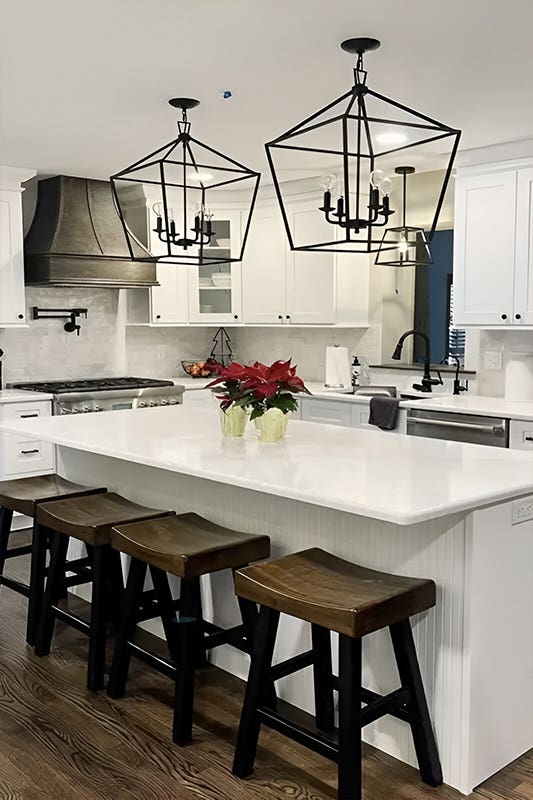 L shape white kitchen with large island 