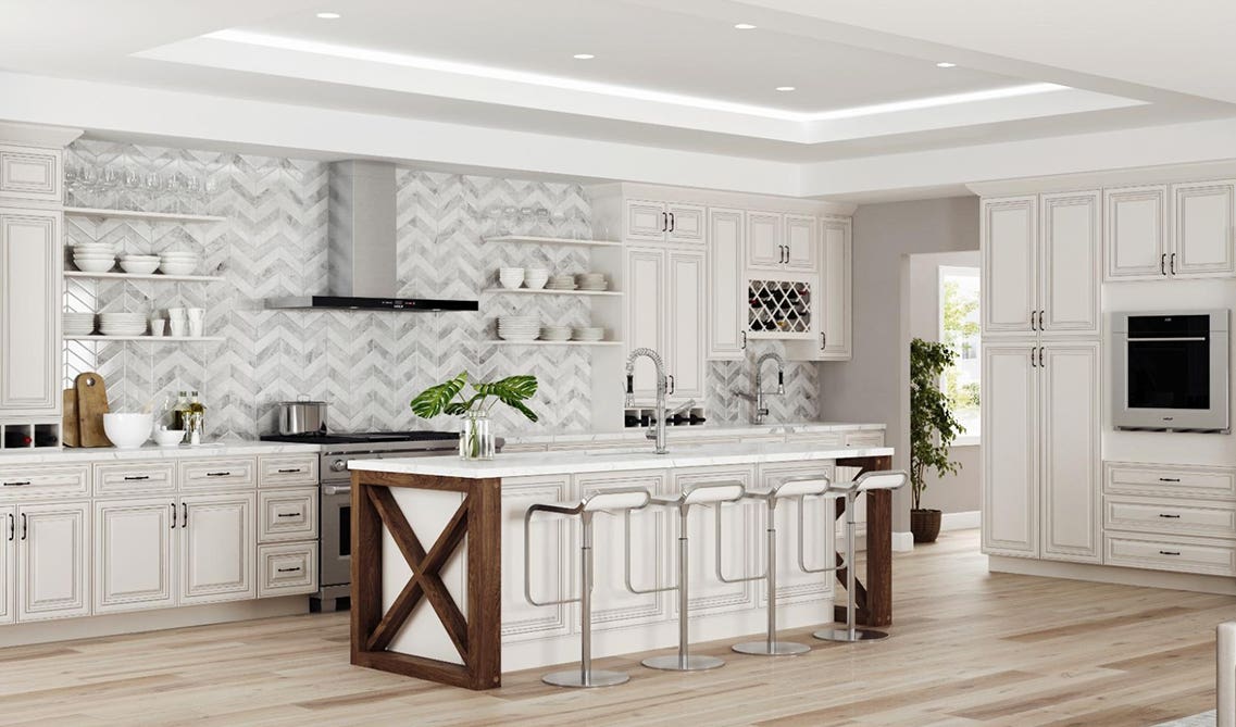 Linen kitchen cabinets paired with functional island and stainless steel appliances