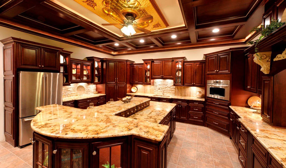 Solid wood cabinets paired with marble countertop and tile flooring