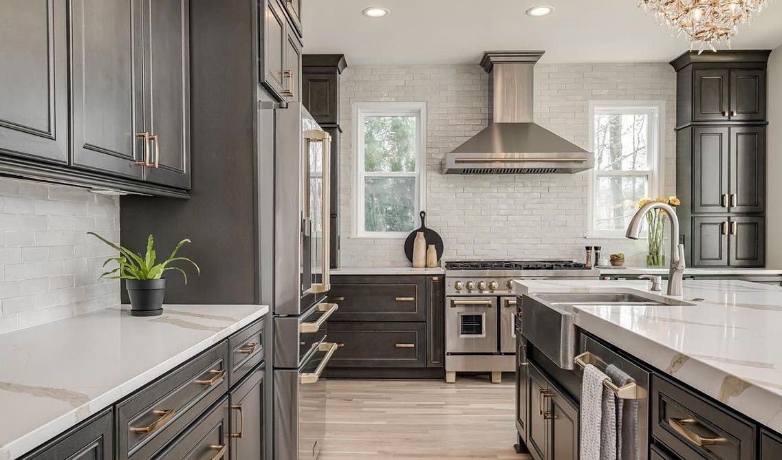 Driftwood Grey Cabinets paired with gold pulls and marble countertop