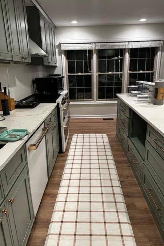 Kitchen design with Green Shaker cabinets and white marble countertops