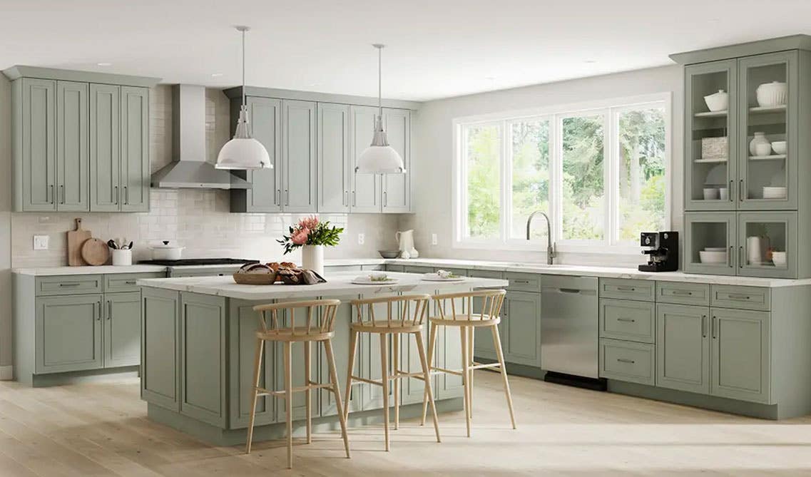 Green Shaker kitchen cabinets with white countertops and SPC flooring