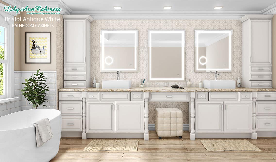 Bathroom design with vanity with countertop, double sink with mirrors, and freestanding bathtub beside window