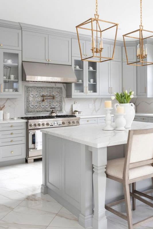 Marble flooring with grey cabinets kitchen 