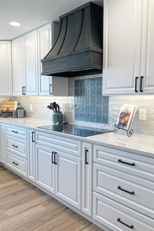 Kitchen with white cabinets and Matt Black Handles 