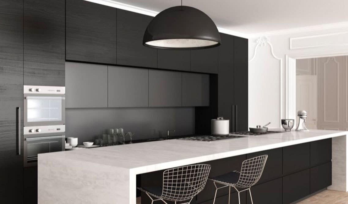 Black Matte cabinets with large island kitchen design and large ceiling pendent light 