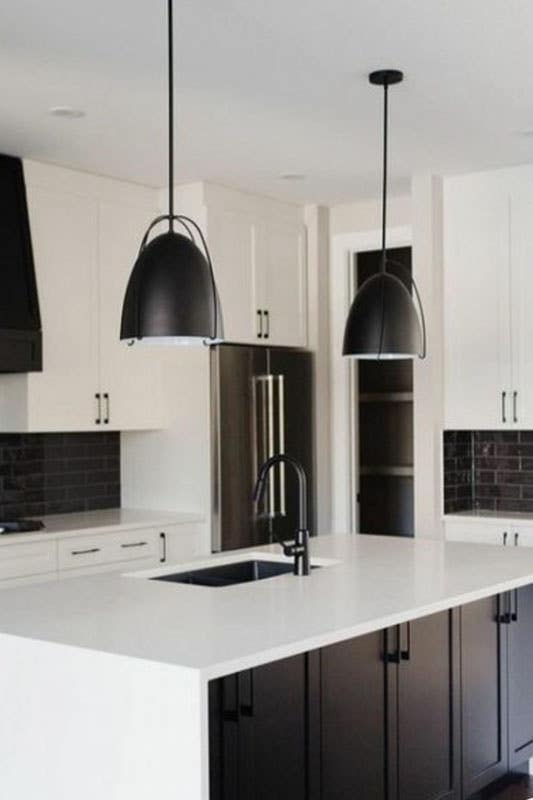 Black and white kitchen with matt finish pendent lights