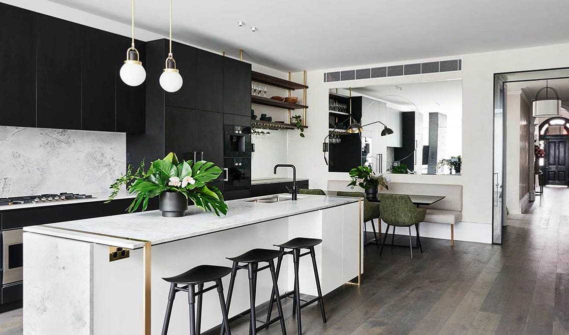 Simple black cabinets with minimal hardware and white island