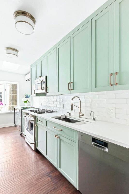 Mint Green Kitchen cabinets with subway tile backsplash 