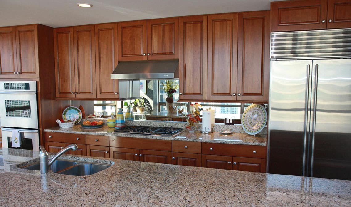 Mirror backlash with brown cabinets 