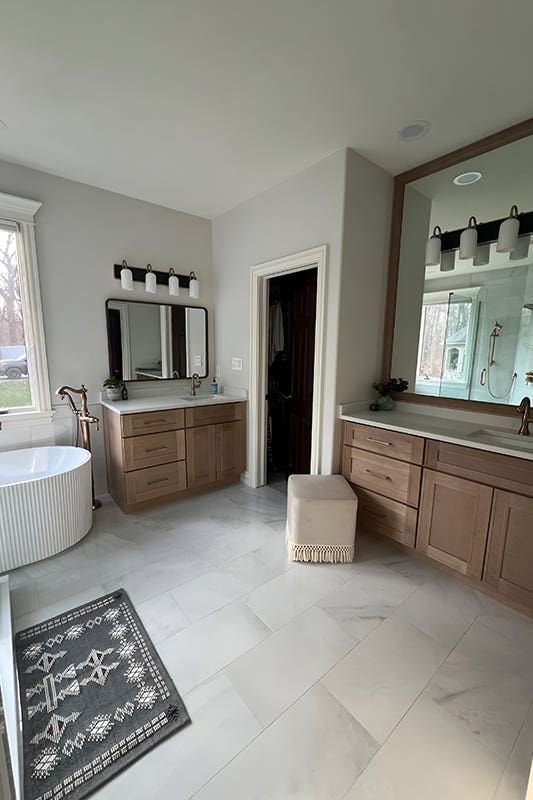 Trending Natural bathroom vanity paired with white countertop, Gold fitting and fixture and free standing bath vanity