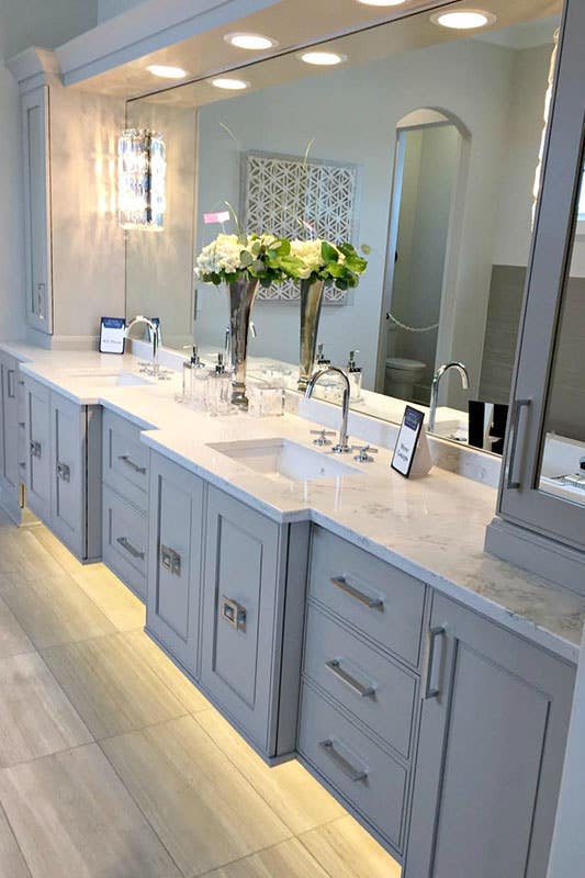 modern vanity grey cabinets, chrome hardware, double sinks and LED under cabinet lighting