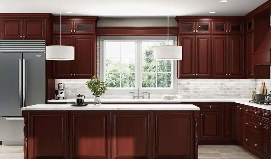 Cherry Cabinets with white countertop and white backsplash 