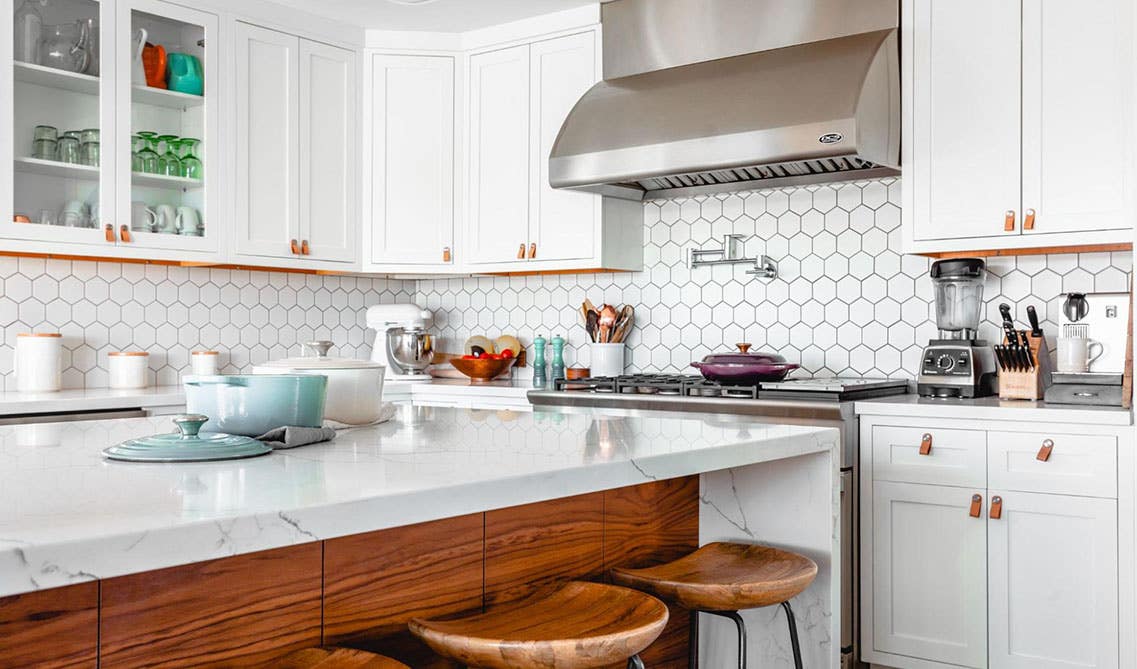 White cabinets with mosaic tiles kitchen design 