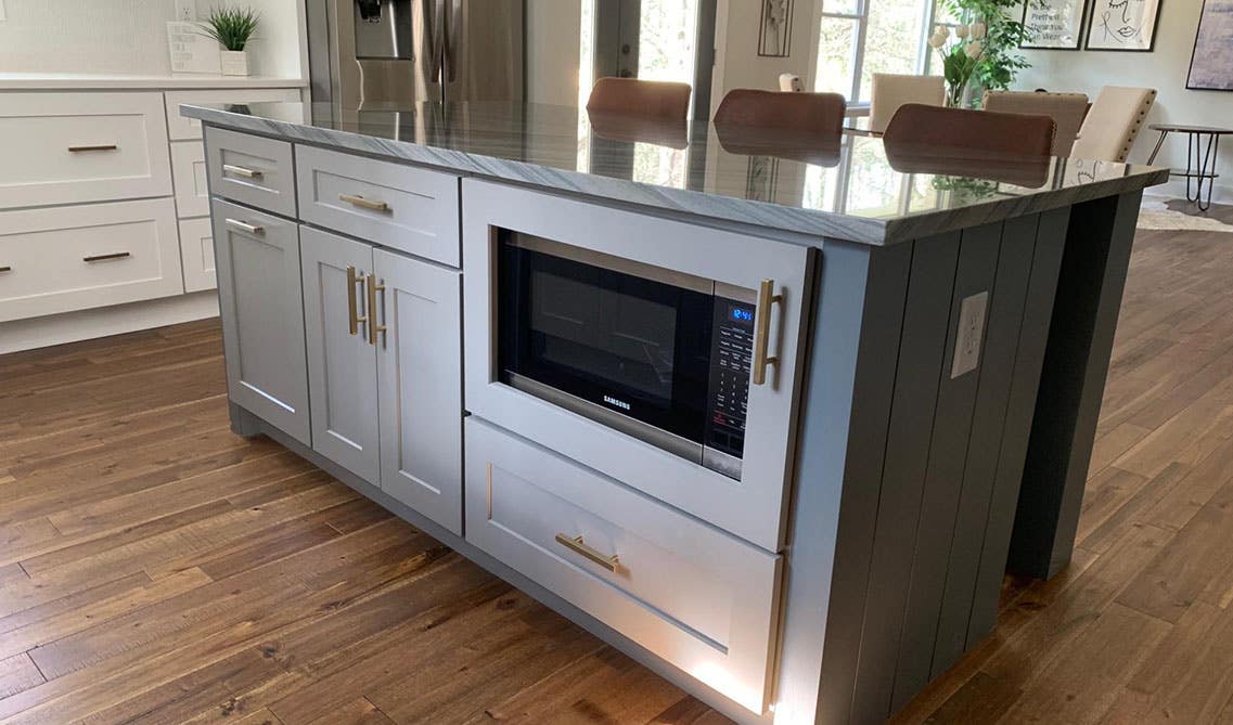 A Kitchen Island with hidden microwave compartment