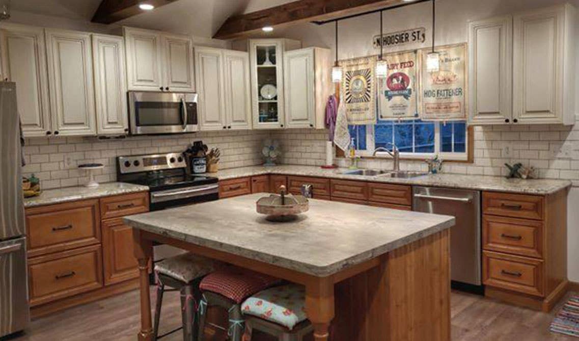 Dual tone white and brown cabinet kitchen paired with Stainless steel appliances 