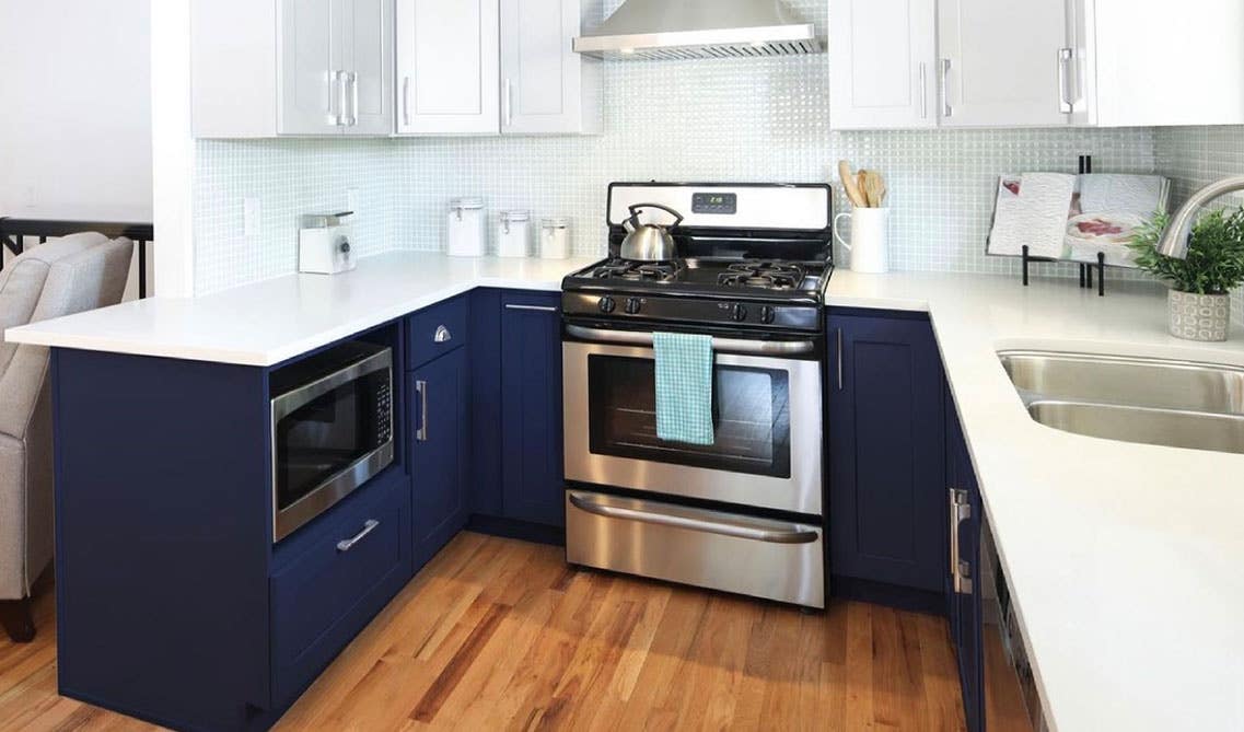 Two tone kitchen with Navy Blue and white Shaker Cabinets